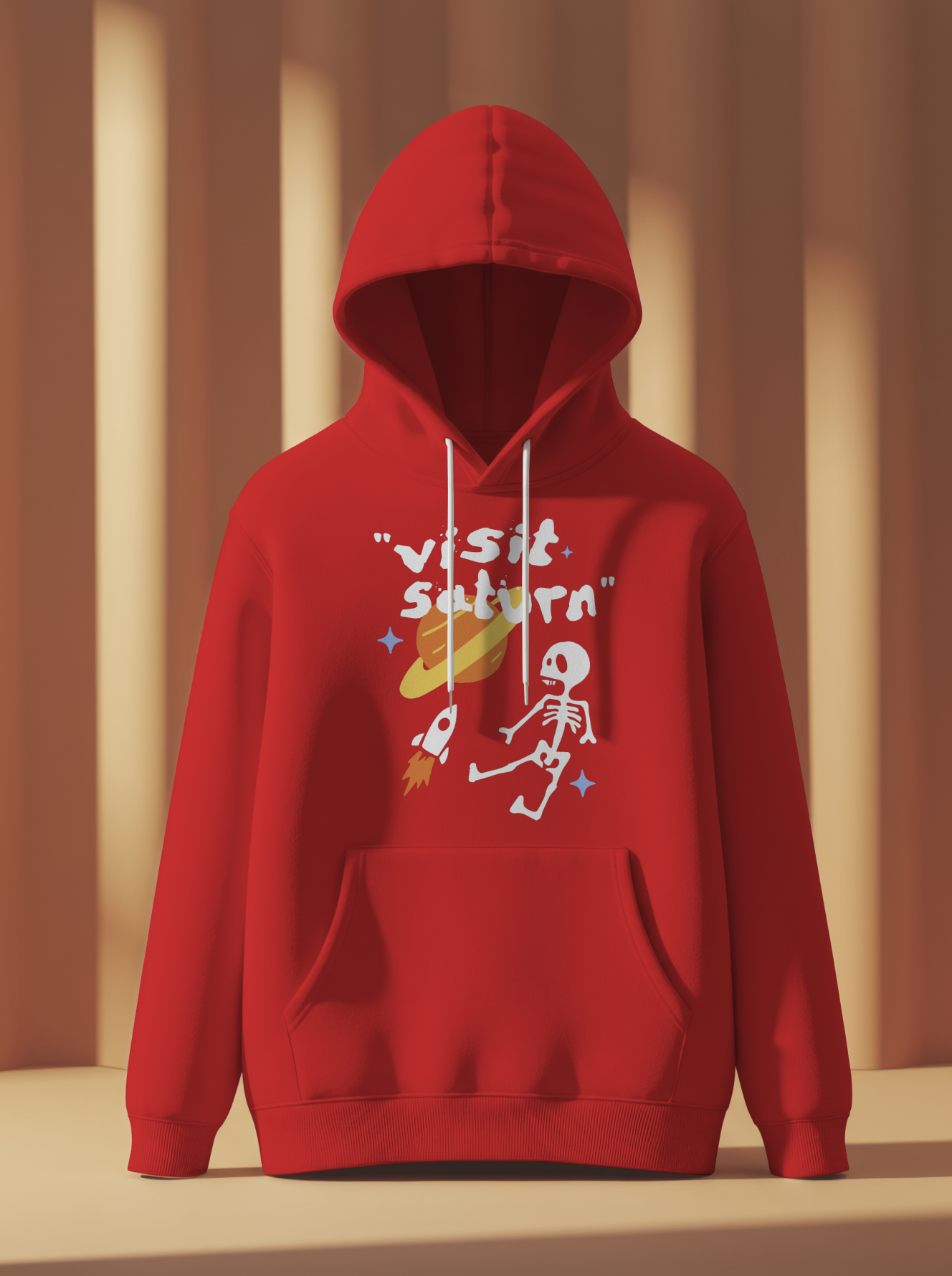 Red hoodie with graphic design on a neutral background